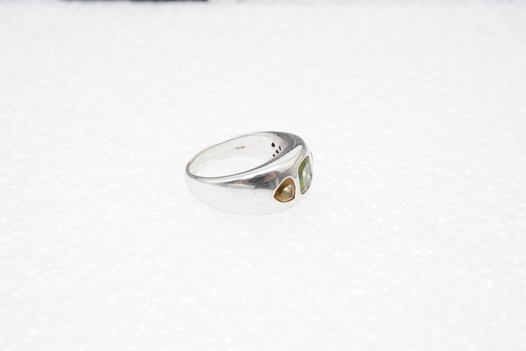 A peridot and citrine dress ring